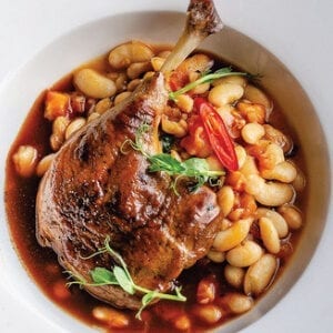 Duck legs confit with beans and wine sauce