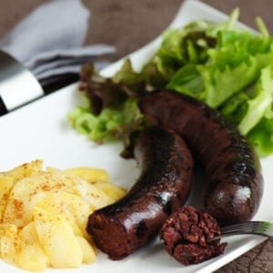 2 boudin noir - butifarra cooked with potatoes and salad